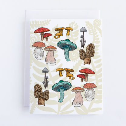 A vibrant mushroom-themed greeting card by Bean Horse Car Designs, featuring colorful illustrations on a pale fern background, designed by Kate Pinto. Comes with a white envelope.