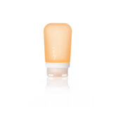 The Humangear GoToob+ is a small, soft orange silicone bottle with a white screw-on cap. Marked 2.5 and 7, it stands upright—perfect as a leak-proof, refillable toiletry travel container.