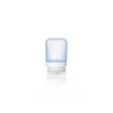 The Humangear GoToob+ is a small, translucent blue silicone travel bottle with a white flip-cap, standing upright. This refillable toiletry container has front measurement markings and is perfect as a leak-proof travel accessory.