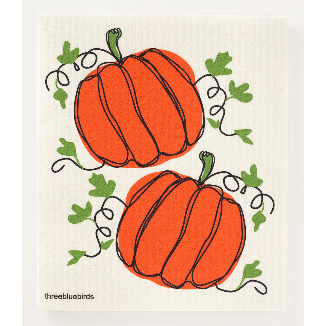 two pumpkins on a swedish dish cloth