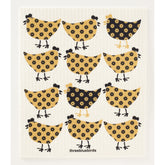The Birds and Chickens Swedish Dishcloth by Three Bluebirds features twelve cartoon chickens—six yellow with black flowers, six black with yellow flowers—plus "threebluebirds" at the bottom. Perfect for sustainable cleaning.