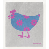 The Birds and Chickens Swedish Dishcloth from Three Bluebirds Swedish Dishcloths features a gray textured surface with a blue chicken, pink and purple-centered flowers, pink accents, and “threebluebirds” in pink—ideal for sustainable cleaning.